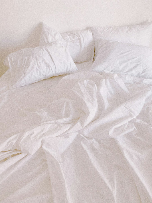 Crisp white bedding with pillows